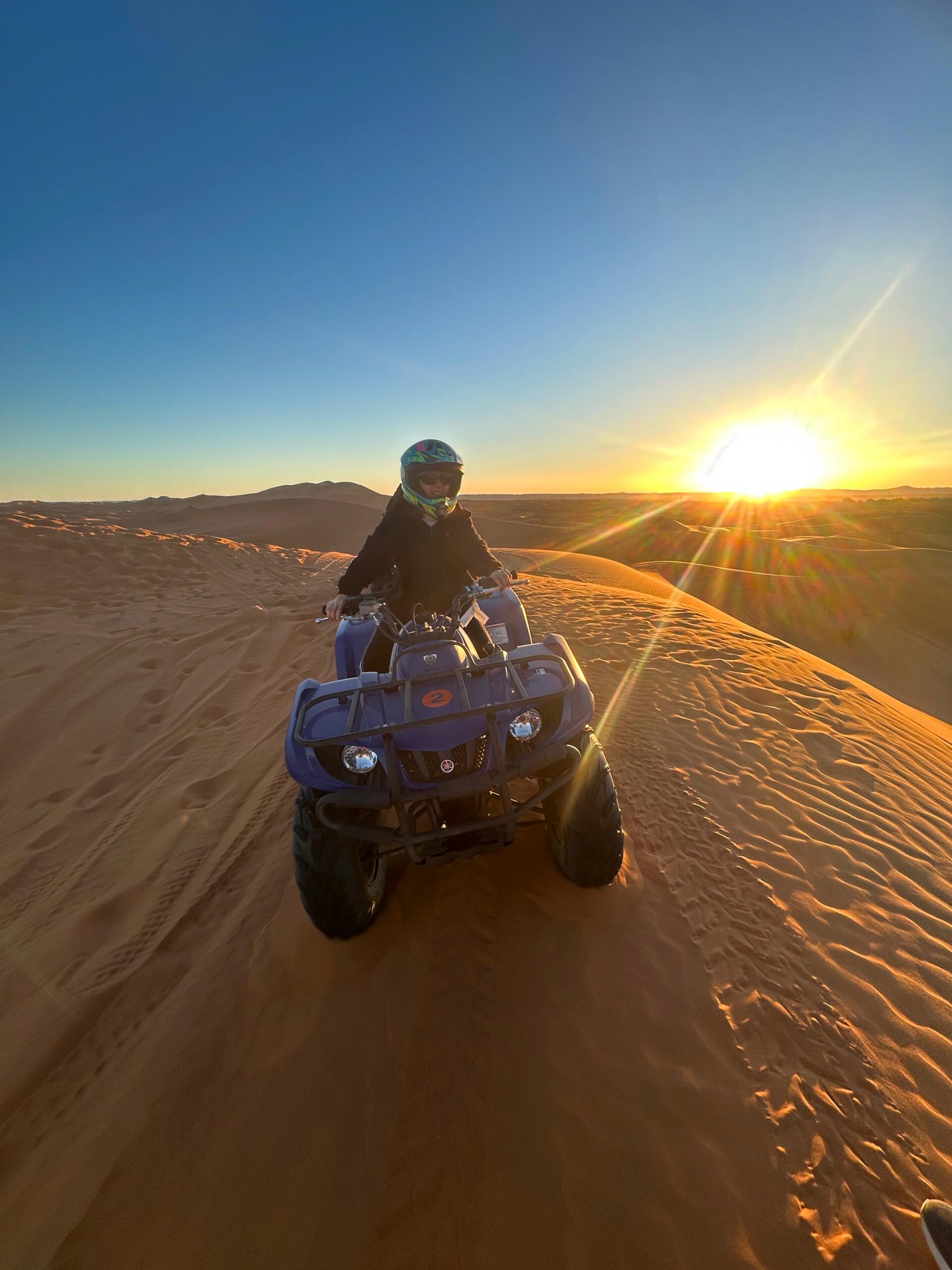 Tourist enjoying a quad biking experience in the Sahara Desert
